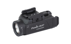 Fenix GL07 black compact pistol light mounted on a handgun rail with tail switch controls
